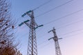 Detailmof two electricity pylons against clear sky at dusk Royalty Free Stock Photo