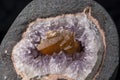 Details of an Amethyst geode with an embedded piece of brownish quartz crystal 2