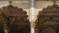 Details of ancient Indian architecture. The carved columns and openwork arches Royalty Free Stock Photo