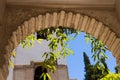 Details of the arch of the Generalife courtyard with its famous fountain and garden. Alhambra de Granada complex Royalty Free Stock Photo