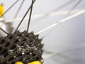 A bicycle chain and sprockets with blurry spokes at the back wheel of a race bike Royalty Free Stock Photo