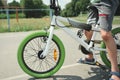 Details: bicycle chain wheel frame, parts bicycle wheel, cycling road bike frame. Cropped view of child boy riding bike