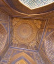 Blue interior of dome with gold gild of Tile Karl Madrasa in The