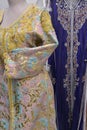 Details of a blue Moroccan caftan for women, and golden lace