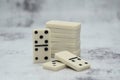 Details of board game dominoes on abstract gray background