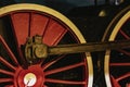 Details of bright red wheels, fragment of old locomotive closeup. Absract vintage background