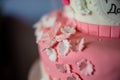 Details of a butterfly and flowers on a children kids pink cake bakery. Happy birthday girl. Royalty Free Stock Photo