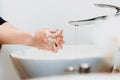 Details of caucasian woman washing hands and cleaning hands from germs, bacteria and viruses with soap and water