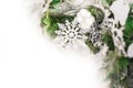 Details of Christmas tree decor in white close-up and copy space. Christmas tree branches and white toys with empty space. Snowfla Royalty Free Stock Photo