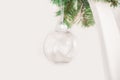 Details of Christmas tree decor in white close-up and copy space. Christmas tree branches and white toys with empty space. Snowfla Royalty Free Stock Photo