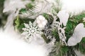 Details of Christmas tree decor in white close-up and copy space. Christmas tree branches and white toys with empty space. Snowfla Royalty Free Stock Photo