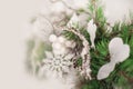 Details of Christmas tree decor in white close-up and copy space. Christmas tree branches and white toys with empty space. Snowfla Royalty Free Stock Photo