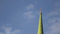 Details of the Church, religion concept. Stock footage. Bottom view of the Orthodox golden cross on the green roof of