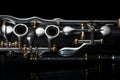 Details of a clarinet with silver keys and golden sockets Royalty Free Stock Photo