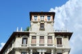 Details of classical renaissance building downtown Madrid, Spain against Vibrant blue sky with vivid white cloudscape Royalty Free Stock Photo