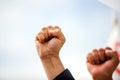 Details with the closed fist of an angry protestor during a political rally