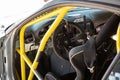 Details of the cockpit of a drift racing car, offset steering wheel, anti-roll bars