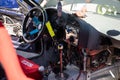 Details of the cockpit of a drift racing car, an offset steering wheel, and hydraulic handbrake