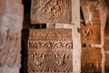 Details of columns designed in 6th century inside Hindu temple of Badami, India. Artwork in historical Indian structure