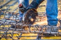 Details of construction engineer worker cutting steel bars and reinforced steel at building site