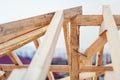 Details Of Construction Site, Timber Structure Of Truss Roof System. The Wooden Structure Of New Building
