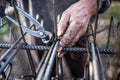 Details of construction worker - hands securing steel bars with wire rod for reinforcement of concrete Royalty Free Stock Photo