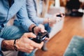 Details of couple playing video games and using joystick controllers. Digital technology lifestyle concept Royalty Free Stock Photo