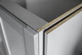 Details of custom kitchen cabinets of the gray modular kitchen from chipboard material on a various stages of