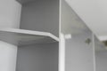 Details of custom kitchen cabinets. Gray modular kitchen from chipboard material on a various stages of installation in