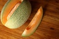 Details of cut cantaloupe on dining table Royalty Free Stock Photo