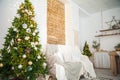 Details of the decorated New Year`s interior. Scandinavian living room and kitchen for Christmas. The comfort of homely rustic dec Royalty Free Stock Photo