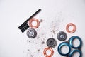 Details of a disassembled dirty shaver head and a cleaning brush on a light background. Soft selective focus. Copy space