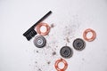 Details of a disassembled dirty shaver head and a cleaning brush on a light background. Soft selective focus. Copy space