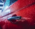 Details of electric car. Door handle and rain drops. Royalty Free Stock Photo