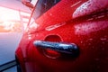Details of electric car. Door handle and rain drops. Royalty Free Stock Photo