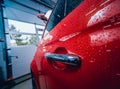 Details of electric car. Door handle and rain drops. Royalty Free Stock Photo