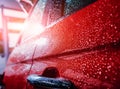 Details of electric car. Door handle and rain drops. Royalty Free Stock Photo