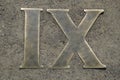 Details and elements. Roman numeral nine. Cast from brass.