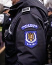 Details with the emblem of Bucharest Local Police Politia Locala sector 3 on the uniform of a police officer