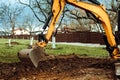 Details of excavator doing earth moving and digging during landscaping works