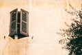 Details of French architecture, wooden window with shutters, retro style Royalty Free Stock Photo