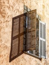 Details of French architecture, wooden window with shutters, retro style Royalty Free Stock Photo