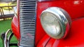 Details of the front headlight lamp red vintage classic car Royalty Free Stock Photo