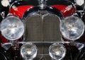 Details with the front part and emblem of a retro 1928 Auburn 8-115 Boattail Speedster retro car