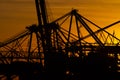 Details of gigantic container gantry cranes at sunset.. Royalty Free Stock Photo