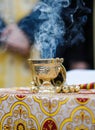 Details with a golden metallic christian orthodox frankincense burner, or censer