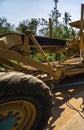 Details of grader is working on road construction. Grader industrial machine on construction of new roads. Heavy duty