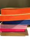 Details of handmade books of different multi colored papers. Notebooks.