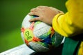 Details with the hands of a boy on an Adidas Conext 19 European qualifiers official soccer match ball