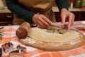 Details: hands of a chef confectioner put cookies cutters on rolled out dough, preparing homemade gingerbread cookies